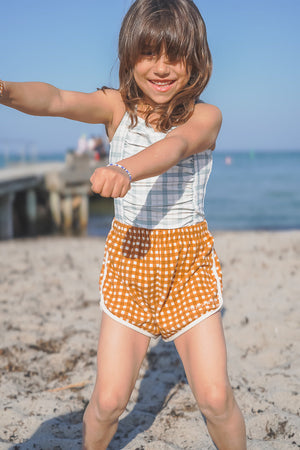 Vintage girls' 1-piece swimsuit in fern plaid, UPF protected, made from recycled materials, angle 5 view.