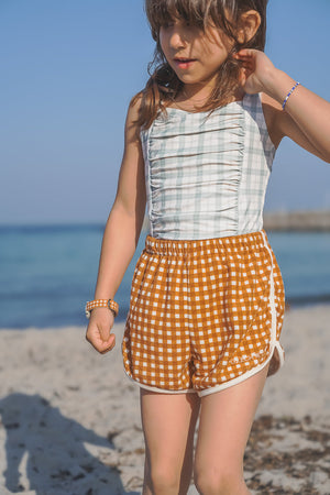 Vintage girls' 1-piece swimsuit in fern plaid, UPF protected and made from recycled materials, angle view 4.