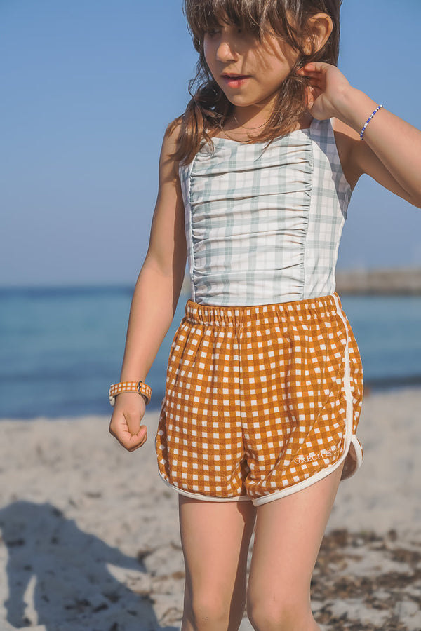 Vintage girls' 1-piece swimsuit in fern plaid, UPF protected and made from recycled materials, angle view 4.
