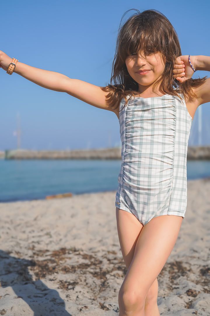 Vintage girls' 1 piece swimsuit in fern plaid, UPF protected and made from recycled materials. Perfect for summer fun!