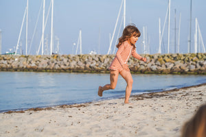 Sweetheart 1 Piece Swimsuit in Buckwheat Plaid - UPF + Recycled, angle view showcasing stylish baby swimwear.