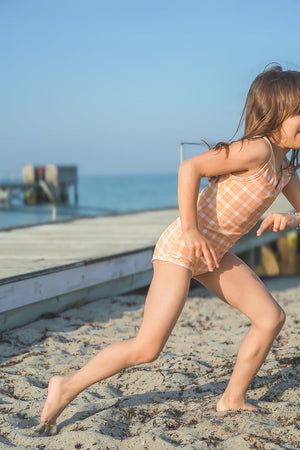 Sweetheart 1 Piece Swimsuit in Buckwheat Plaid, UPF protected, eco-friendly design for baby swimwear.
