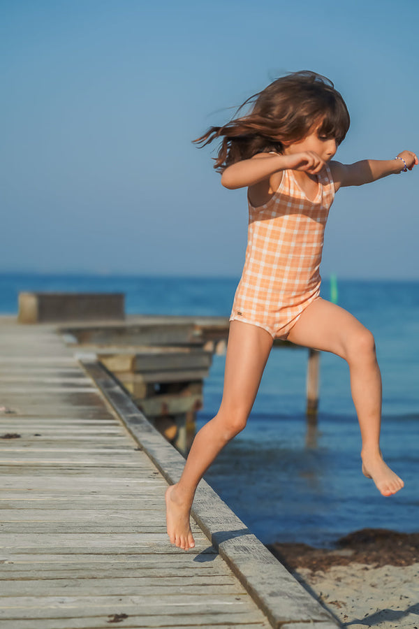 Sweetheart 1 Piece Swimsuit in Buckwheat Plaid, UPF protected, eco-friendly, angle 3 view. Perfect for baby swimwear.