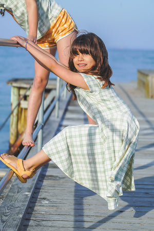 Sweetheart Twirl Dress in Fern Plaid, organic cotton jersey, perfect for baby swimwear, shown from angle 2.