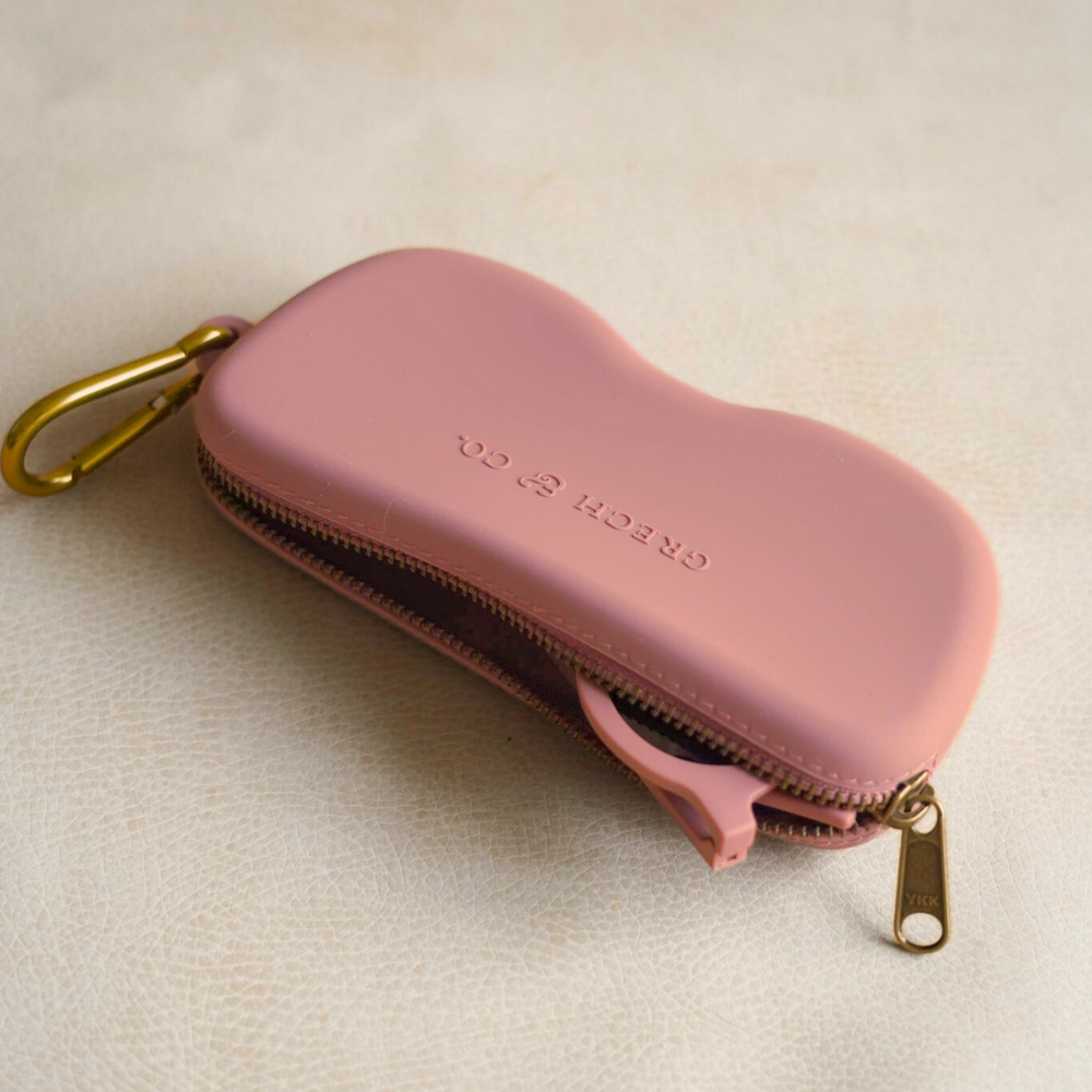 Soft silicone Zip + Go Case in Heather Rose for babies, perfect accessory for on-the-go convenience.