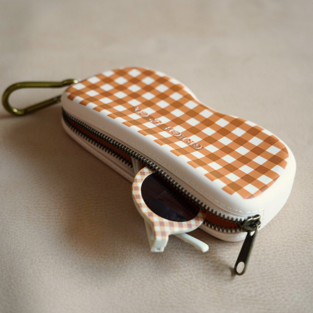 Soft silicone Zip + Go Case in Sienna Gingham for babies, perfect accessory for on-the-go parents.