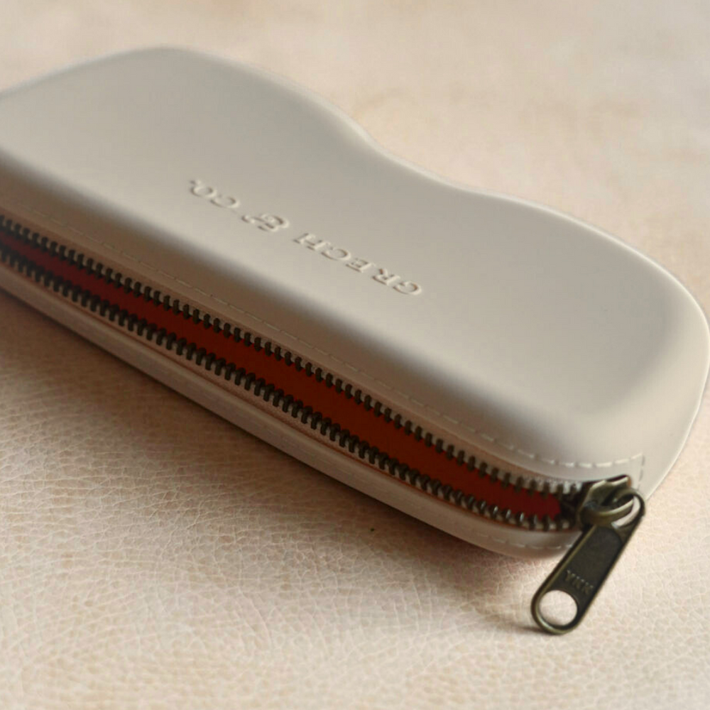 Soft silicone Zip + Go Case in fog color, perfect accessory for baby essentials.