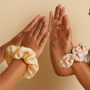 Set of 2 organic cotton hair scrunchies in Sunset Meadow design, perfect for babies and toddlers.