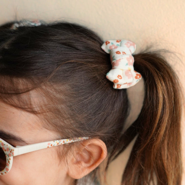 Set of 2 organic pigtail bow hair clips in Sunset Meadow design, perfect for baby accessories and seasonal wear.