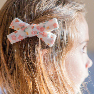 Single Bow Hair Clip in Sunset Meadow, organic accessory for babies, shown from angle 3.