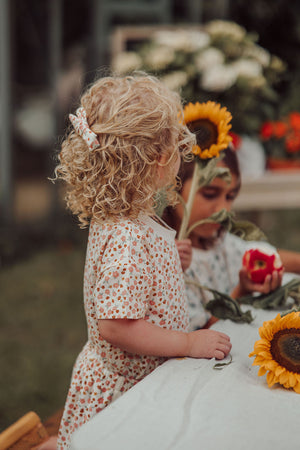 Single Bow Hair Clip in Sunset Meadow, organic accessory for babies, shown from angle 2.