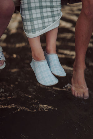 Fern Plaid swim shoes for babies, angle view showcasing stylish design and comfortable fit for water activities.