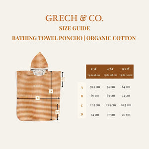 Organic cotton bathing towel poncho for babies in Sunset Meadow design, angled view showcasing softness and style.