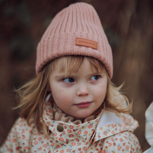 Knit Beanie Wide Rib in Sunset color, angled view showcasing soft texture and stylish design for babies.