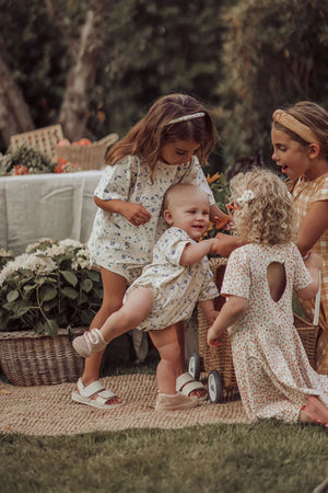 Organic cotton baby bubble romper in fern plaid, angle 8 view, perfect for stylish and comfortable playtime.