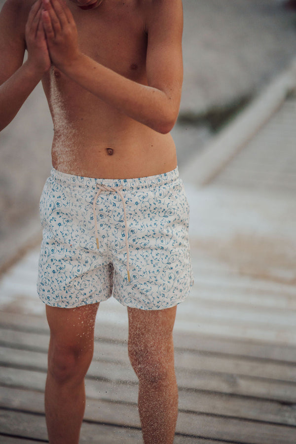 Baby swim trunks in Scandi floral design, UPF protection, made from recycled materials, angle 9 view.