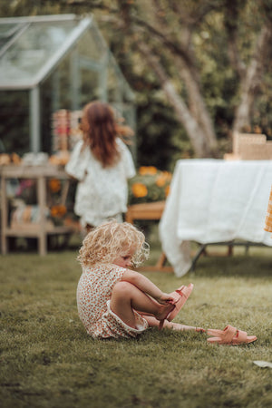 Retro organic cotton terry baby shorts in Sunset Meadow design, angle view 4. Perfect for stylish, eco-friendly outfits.