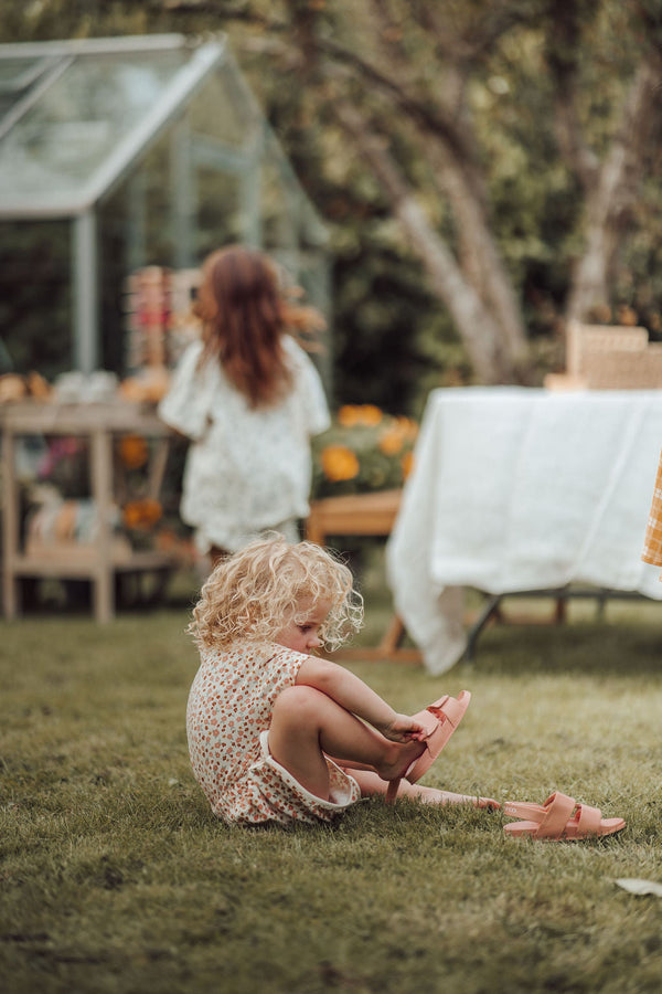 Retro organic cotton terry baby shorts in Sunset Meadow design, angle view 4. Perfect for stylish, eco-friendly outfits.