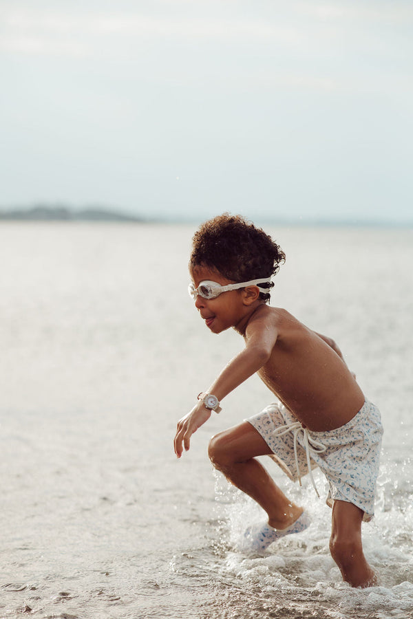 Baby swim trunks in Scandi floral design, UPF protection, made from recycled materials, angle view 7.