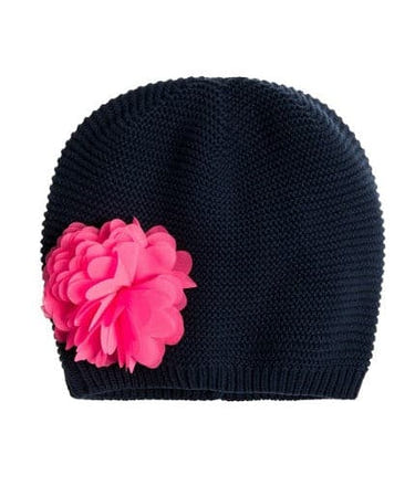 Navy knit beanie for girls with a decorative flower, perfect for stylish warmth.