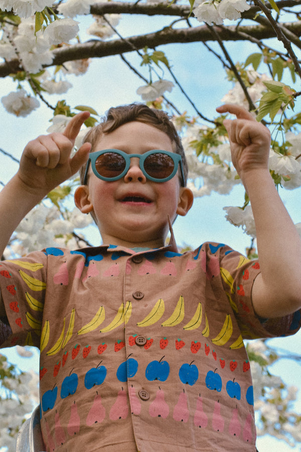 Classic sustainable sunglasses for kids aged 3-8, plant-based, bendable, polarized, shown at angle 16.