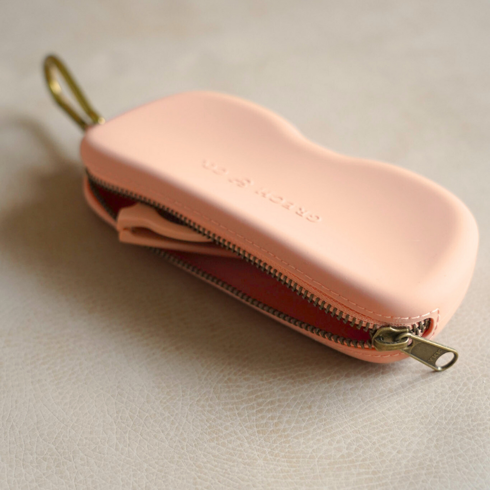 Soft silicone Zip + Go Case in Sunset color for stylish sunglass protection.