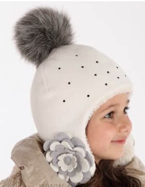 Girl's fleece winter pom pom hat, cozy beanie for cold weather, perfect for little ones.