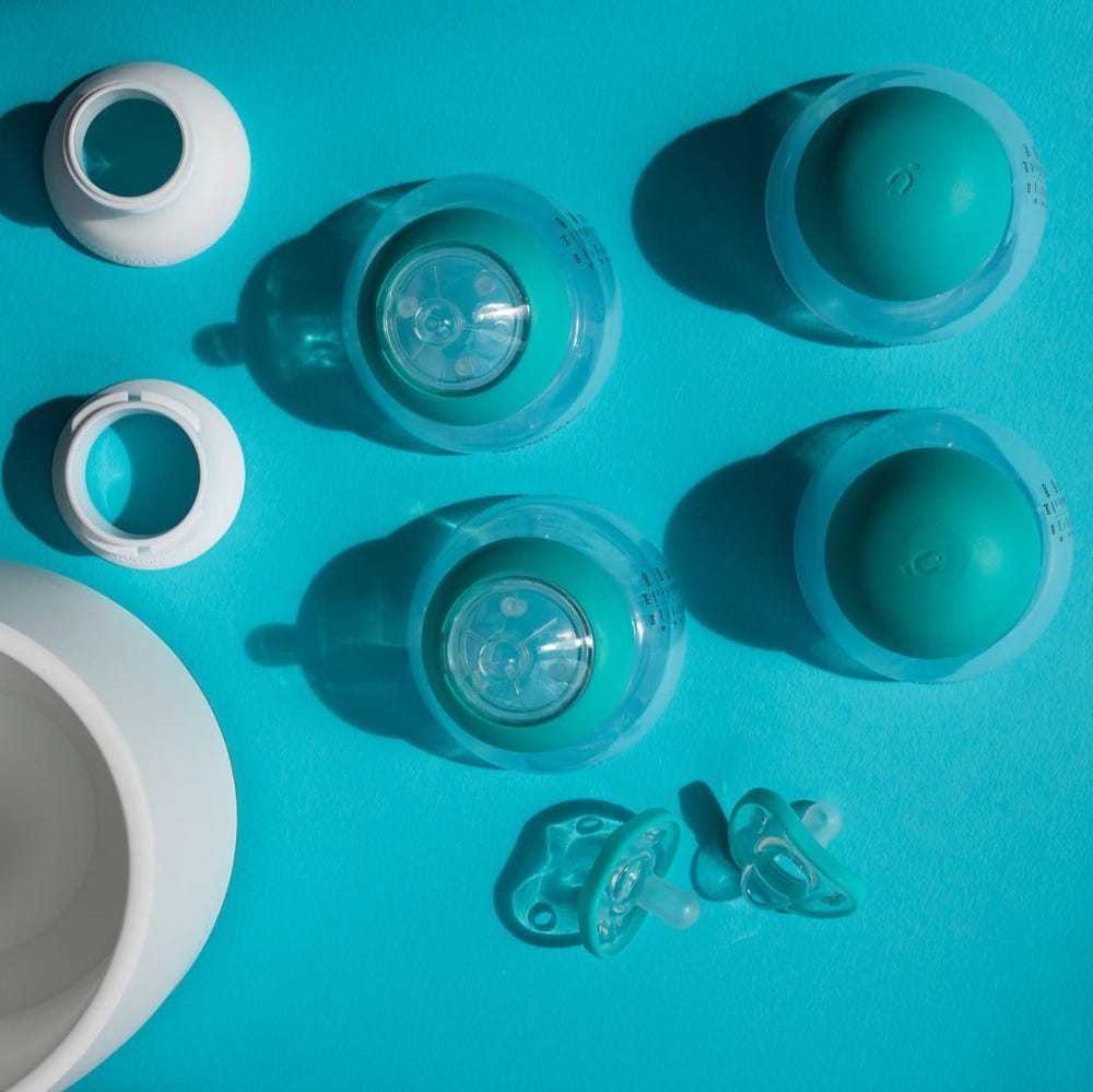 Breastmilk Bottle Starter Set for babies, featuring ergonomic design and easy-to-clean materials.