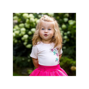 Girls pink summer tulle skirt, perfect for playful outfits and warm weather fun. Angle 4 view.