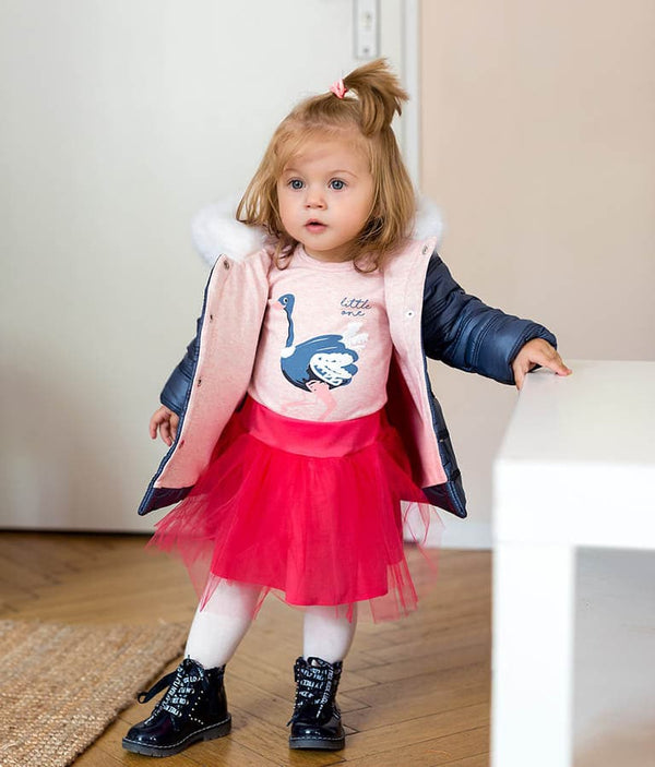 Girls pink summer tulle skirt, angle view, perfect for playful and stylish outfits.
