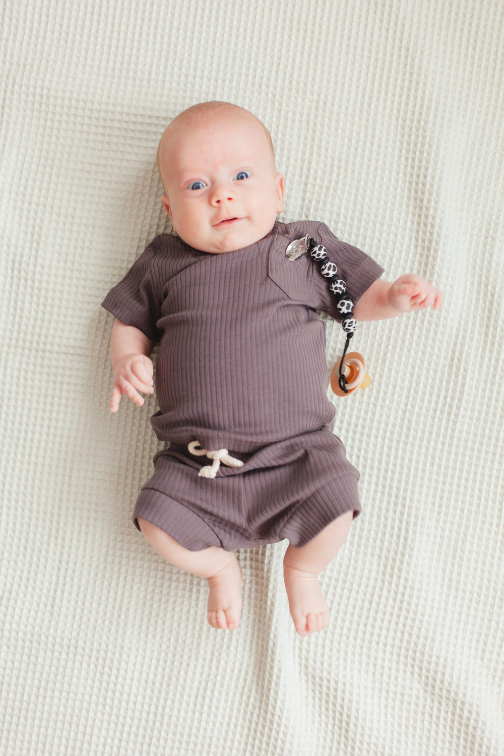 Lauren Clip in Cow design - stylish and functional pacifier clip for babies.