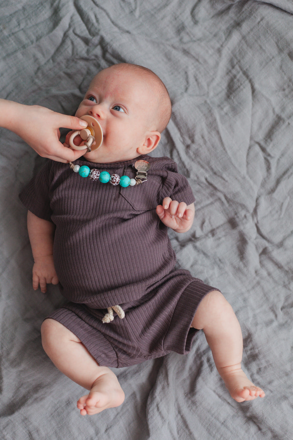 Western-themed pacifier clip for babies, stylish and practical accessory to keep pacifiers secure.