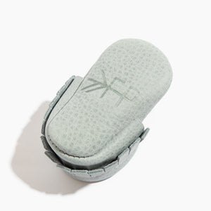Newborn Greatest Snow on Earth moccasin baby shoe, angle 4 view, soft and stylish footwear for infants.