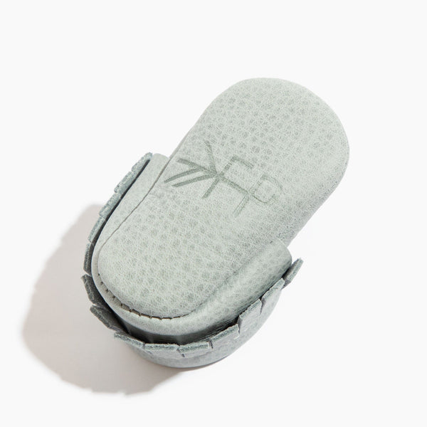 Newborn Greatest Snow on Earth moccasin baby shoe, angle 4 view, soft and stylish footwear for infants.