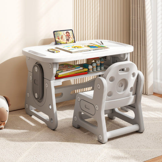 Height adjustable kids table and chair set with tiltable whiteboard and concave shelf in gray. Ideal for play and learning.