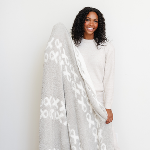 Cozy DOUBLE-LAYER BAMBONI® throw blanket for babies, perfect for swaddling and keeping warm.