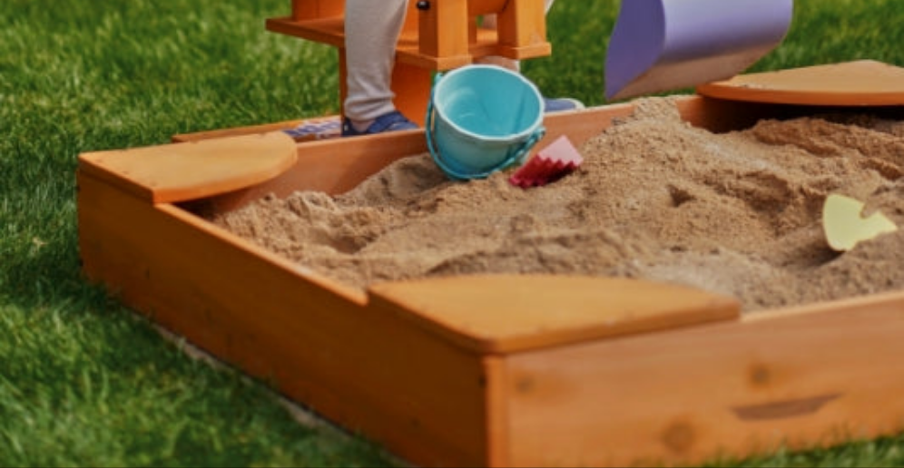 Durable wooden sandbox for outdoor play, ideal for kids and excavators. Perfect addition to any backyard playset.
