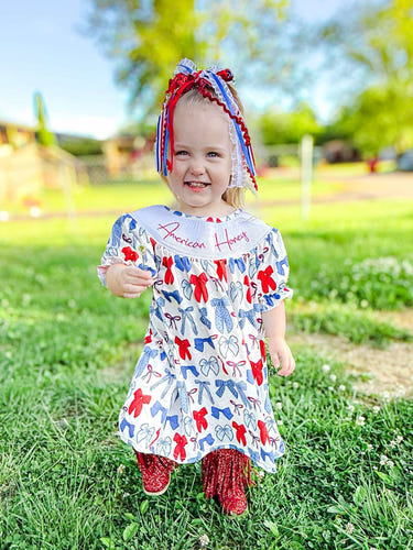 Smocked American honey bows dress for babies, stylish and comfortable clothing for little ones.