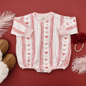 Laced with Love Sweatshirt Romper for babies, showcasing cozy style and comfort from a side angle.