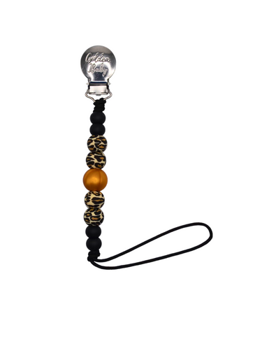 Leopard print strand clip pacifier holder for babies, stylish and functional accessory.