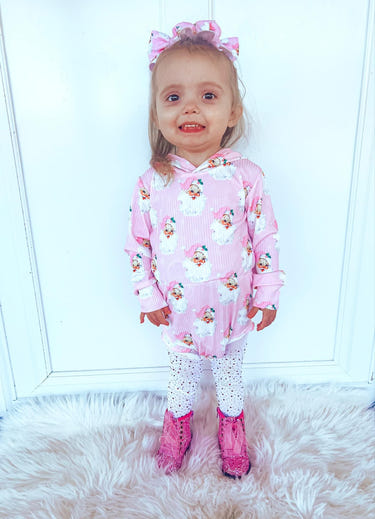 Pink Santa ribbed hooded romper for babies, perfect for cozy sleep and festive occasions.