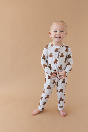 Cozy Bear Zippy zip pajamas for babies in playful design, angle view showcasing soft fabric and adorable details.