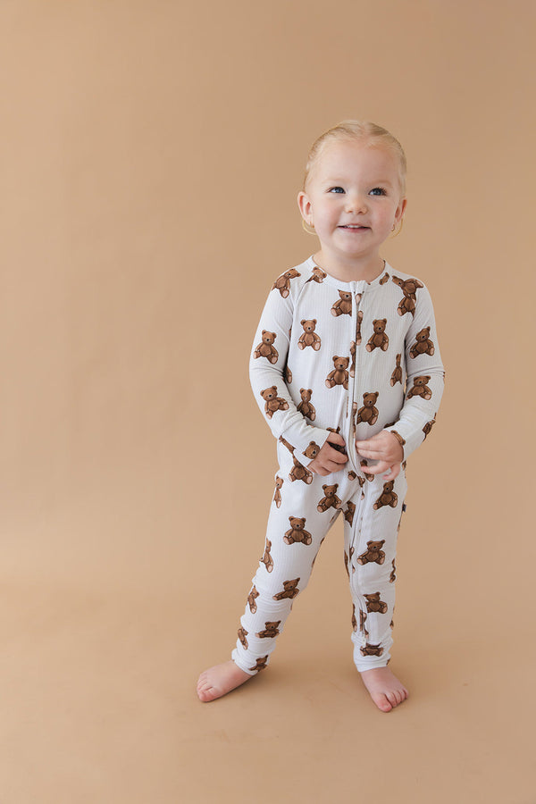 Cozy Bear Zippy zip pajamas for babies in playful design, angle view showcasing soft fabric and adorable details.