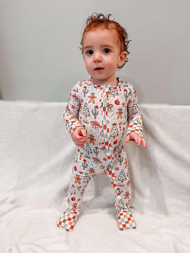 Cowboy Christmas bamboo zip sleeper for babies, 220 GSM, true to size, perfect for cozy holiday nights.