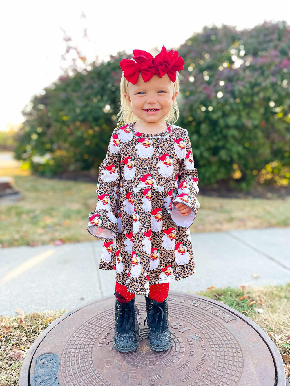 Leopard Santa bell sleeve dress for babies, perfect holiday outfit for festive occasions.