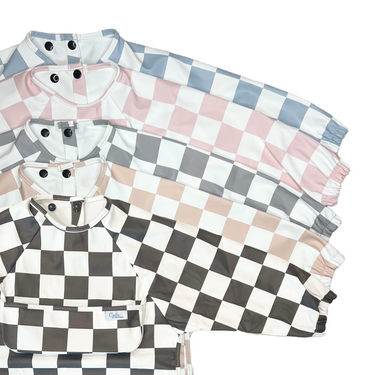Checkered Grayson Long Sleeve Bib for babies, perfect for mess-free feeding and stylish protection.