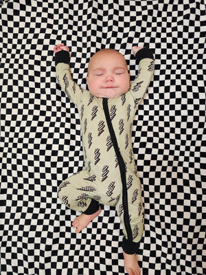 "Strike All Night Zippy baby sleep sack in cozy bedding, angle 7 view showcasing soft fabric and secure fit."