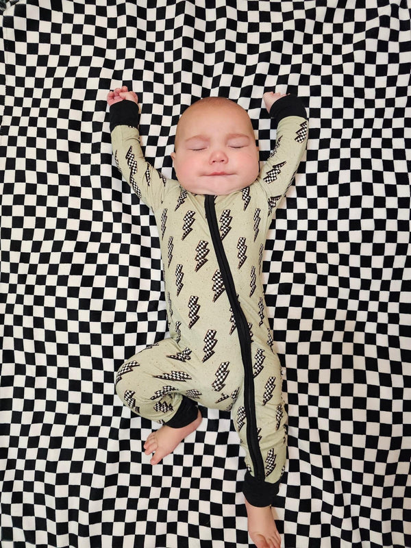 "Strike All Night Zippy baby sleep sack in cozy bedding, angle 7 view showcasing soft fabric and secure fit."