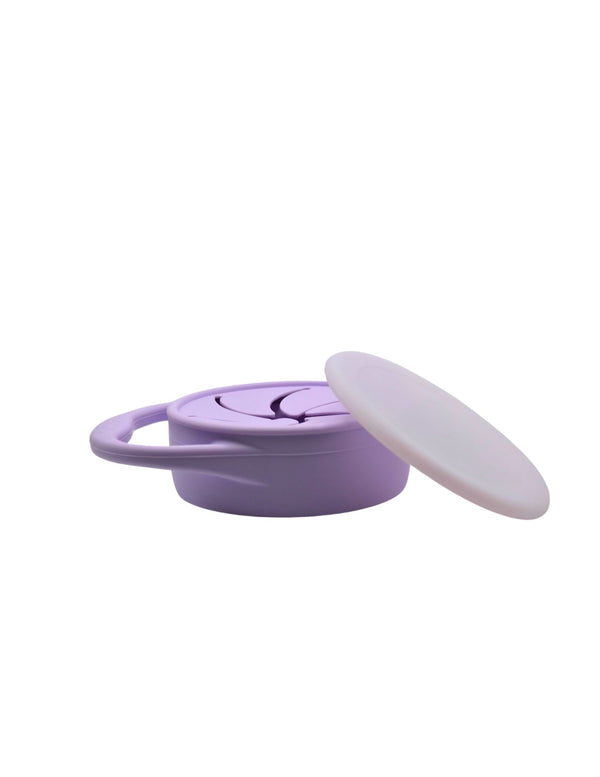 Silicone snack container for babies, featuring a secure lid and ergonomic design, perfect for on-the-go snacks.