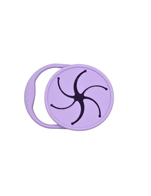 Silicone snack container for babies, featuring a secure lid and easy grip design, angled view showcasing its vibrant colors.